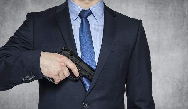 Businessman With A Gun